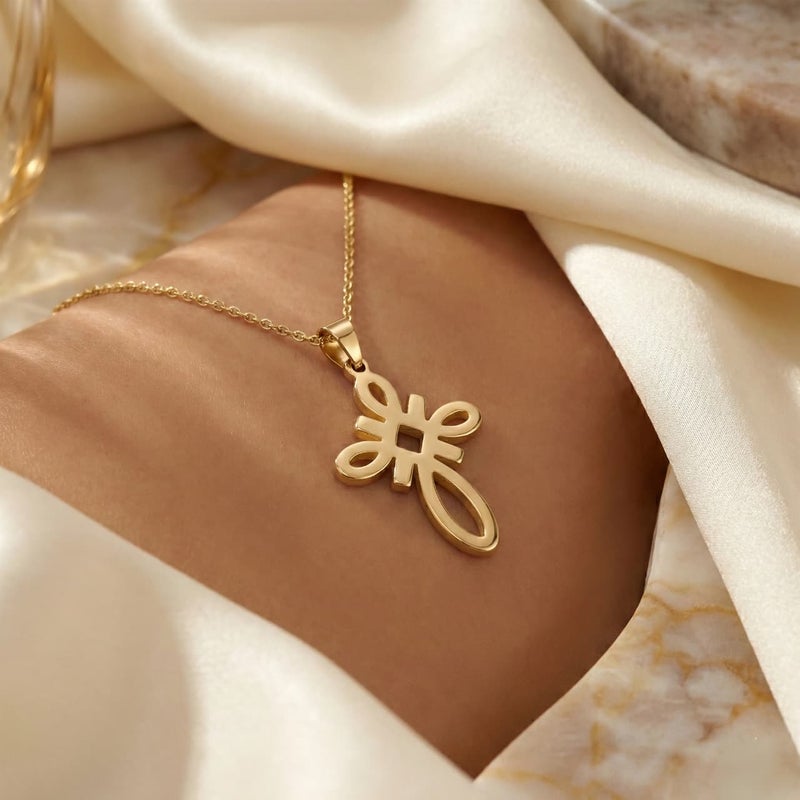 A large gold-tone cross pendant (chain not included), crafted from rust-resistant stainless steel, featuring a sleek, openwork knot design. A distinctive, modern, and spiritual piece. - Image 5